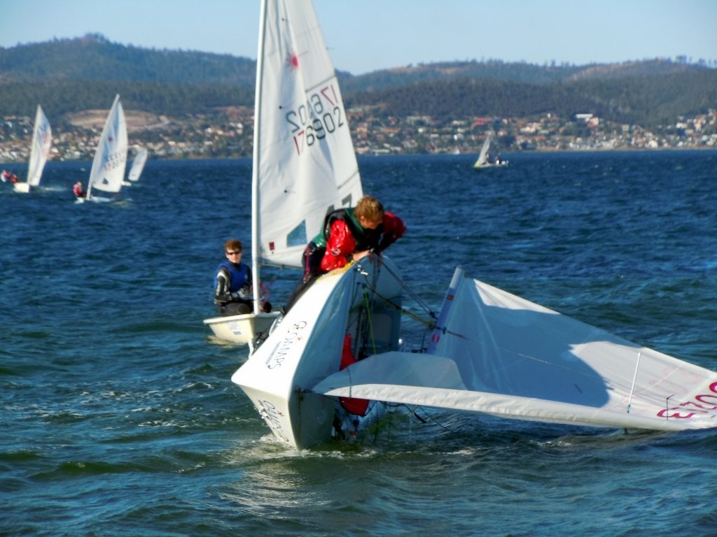 There were plenty of capsizes in the fresh breezes on the Derwent - Tasmanian Schools Regatta and Youth Championship 2012 © Stephen Spaulding